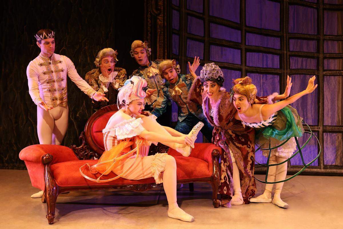 One of the stepsisters struggles to put on Cinderella’s shoe in a comic scene from the World Ballet Company’s “Cinderella,” on stage Sunday, Feb. 22, in Olympia.