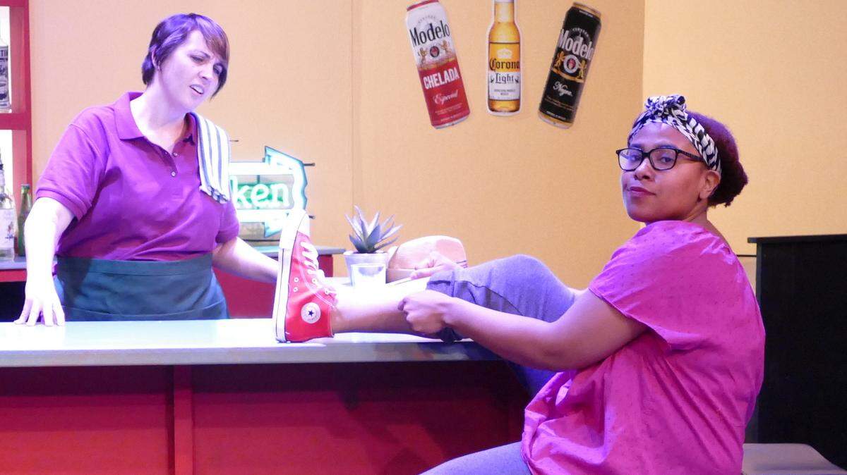 Tannia Montes as Daphne, left, and Ashley Thomas as Ruby in Olympia Little Theater’s production of “Daphne’s Dive.”