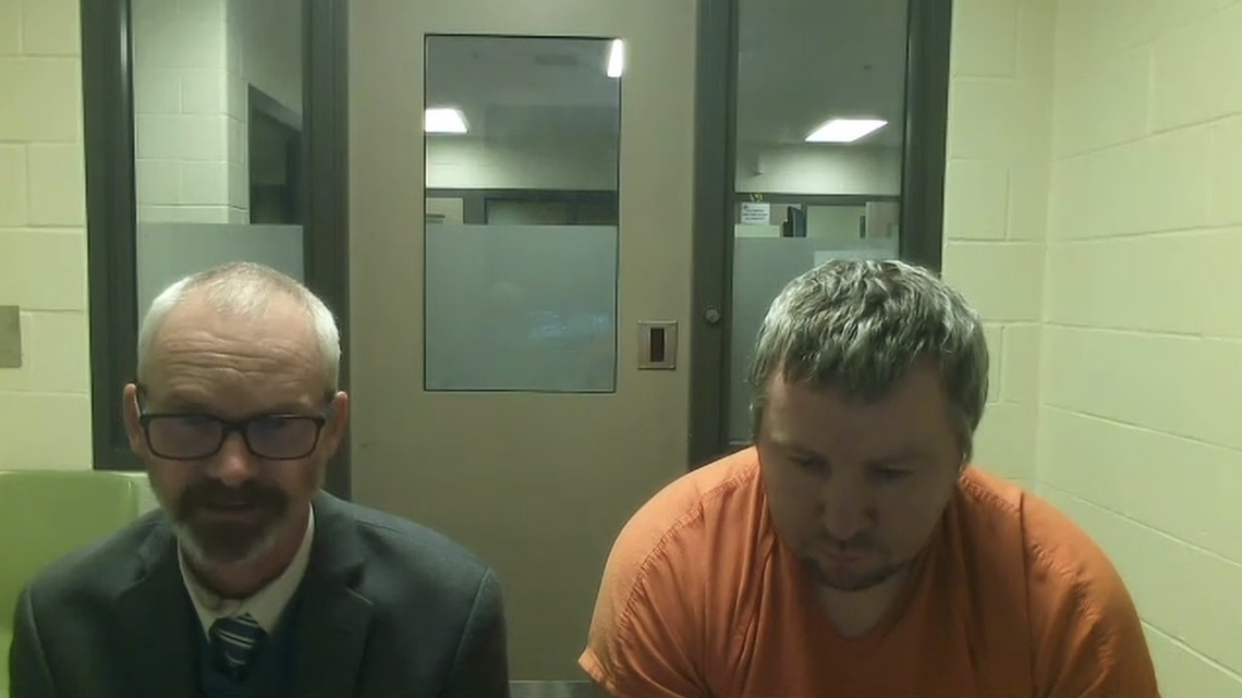 Timothy Burke (right), 45, virtually attends his preliminary hearing in Thurston County Superior Court from the county jail on Monday, Nov. 20. Burke was represented by public defense attorney Kevin Griffin (left).