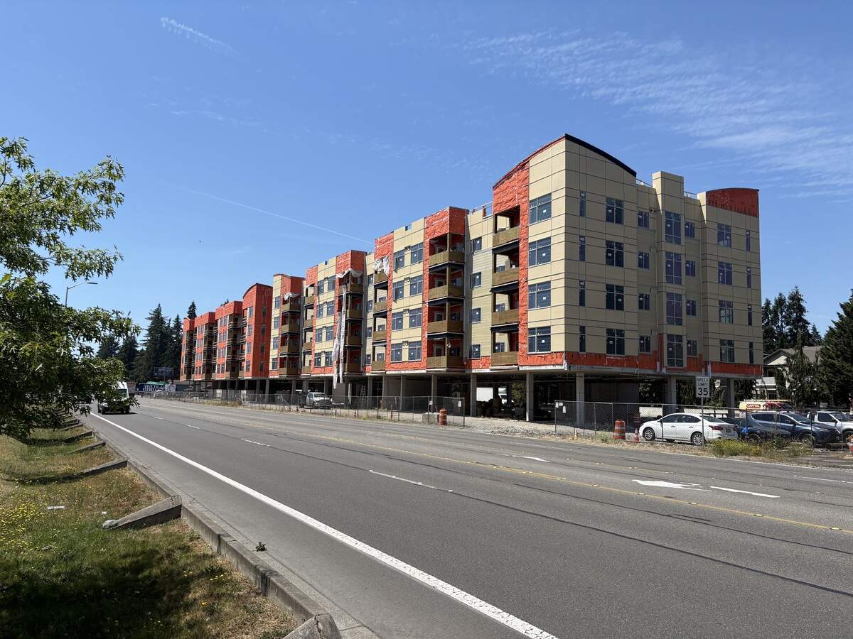 The crane is gone and a 96-unit mixed-use development continues to be built out in the 9100 block of Martin Way East.