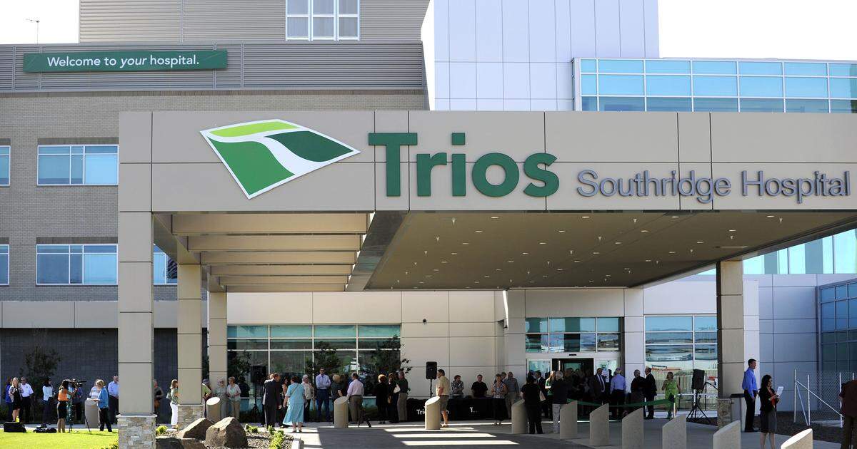 A crowd gathered outside the entrance to the recently completed Trios Southridge Hospital in May 2014 for a ribbon cutting ceremony.