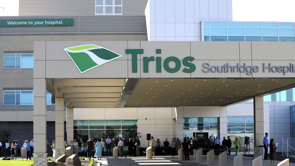 A crowd gathered outside the entrance to the recently completed Trios Southridge Hospital in May 2014 for a ribbon cutting ceremony.