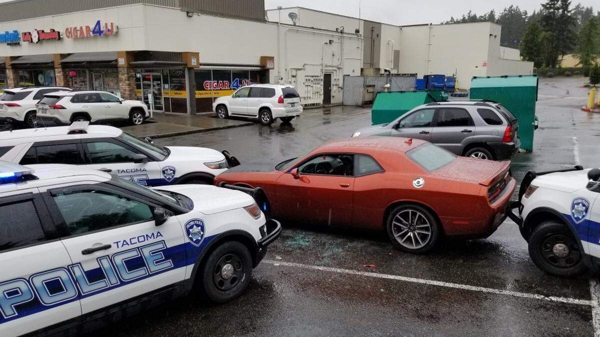 A 30-year-old man was arrested on suspicion of multiple crimes Saturday afternoon at an area strip mall after Tacoma police surrounded his stolen vehicle.