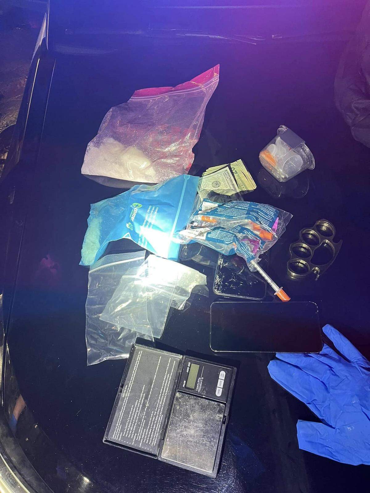 Suspected methamphetamine and brass knuckles were found on the suspect Tuesday night, Thurston Sheriff Derek Sanders said.