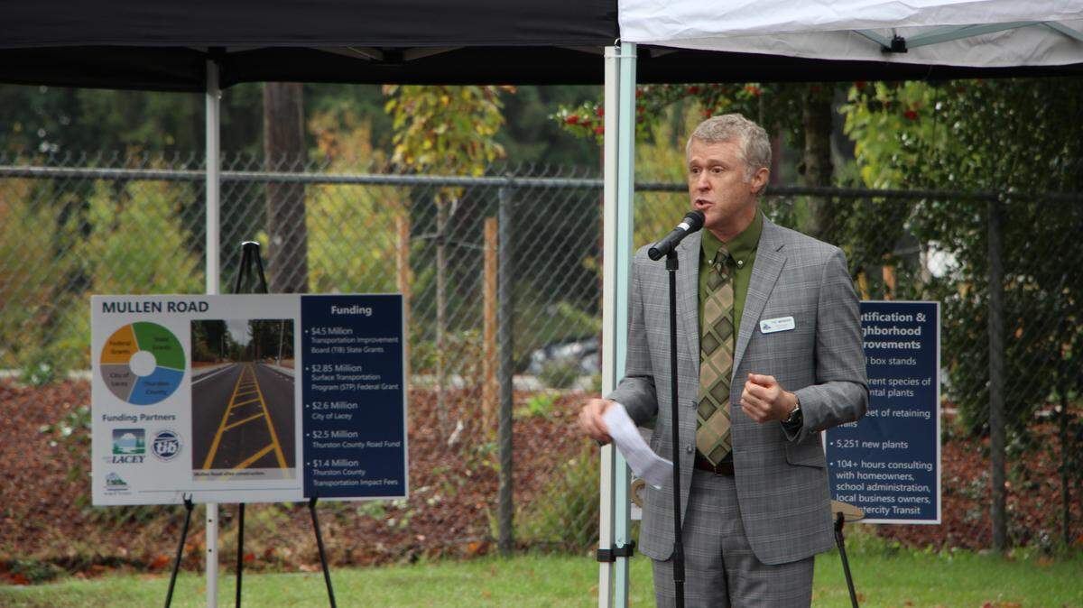 Thurston County Commissioner Tye Menser speaks prior to a ribbon cutting ceremony for the Mullen Road Project on Oct. 1.