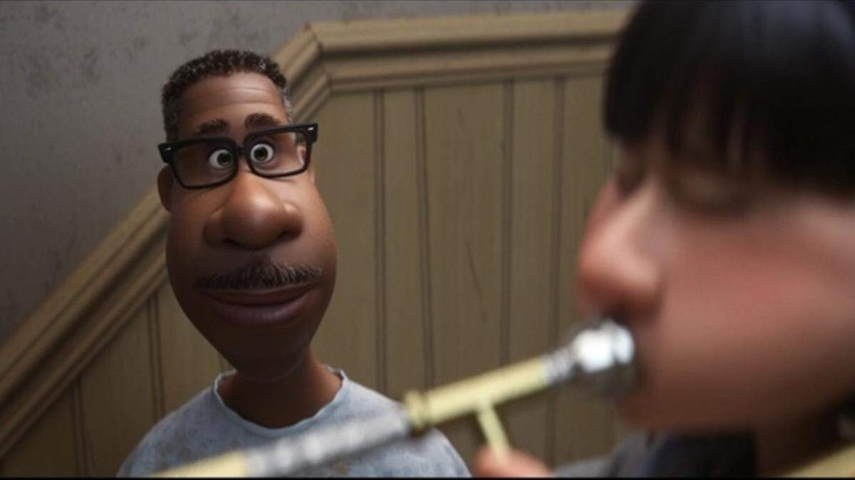 In a scene from Disney/Pixar’s “Soul,” music teacher Joe Gardner (voiced by Jamie Foxx) listens to the playing of an impassioned student.