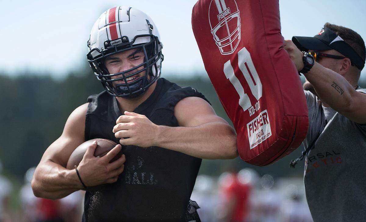 Yelm running back Brayden Platt runs through drills during the Tornados’ preseason football practice at Yelm High School in Yelm, Washington, on Thursday, Aug. 17, 2023.