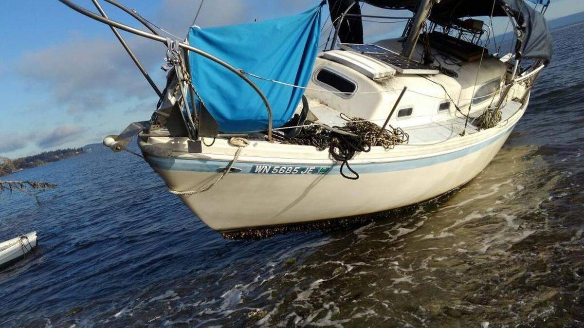 The Coast Guard is searching for Scott Caldwell of Olympia after his sailboat ran aground Thursday morning near Bainbridge Island.