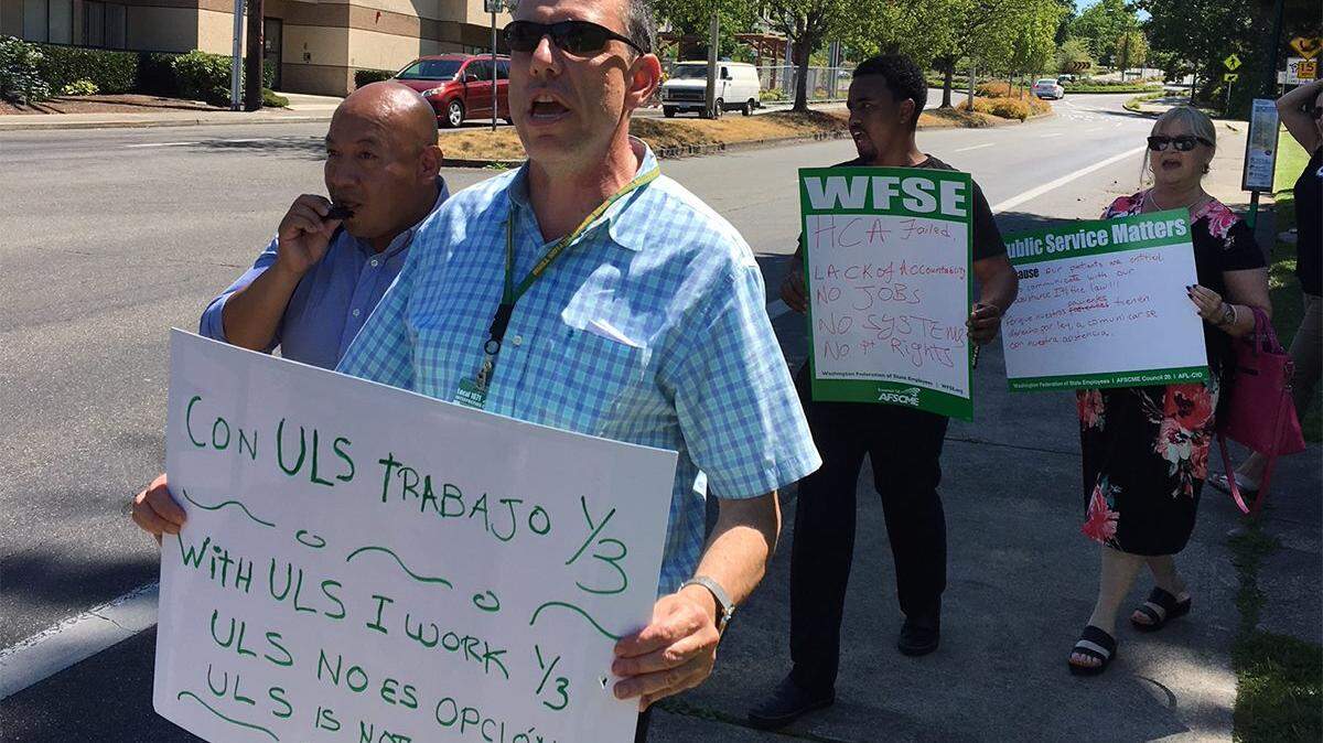 Members of Interpreters United Local 1671 marching to Washington State Healthcare Authority.