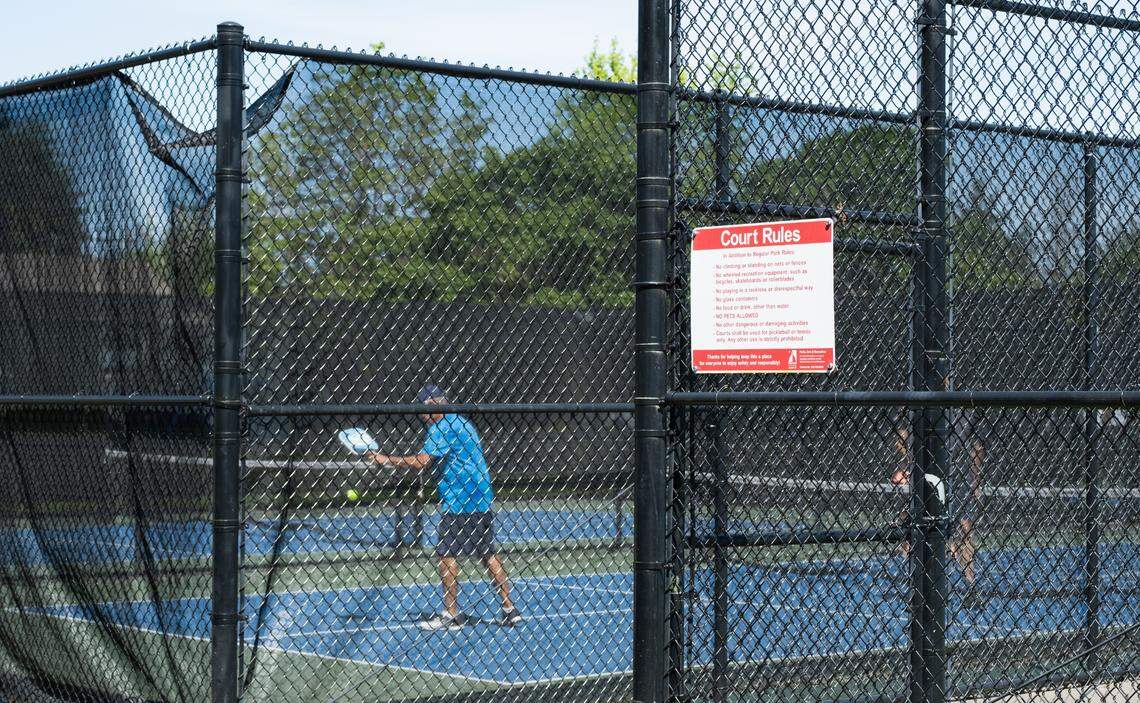 Screens on court fences like these at Woodruff Park can reduce the noise leaving a pickleball court.