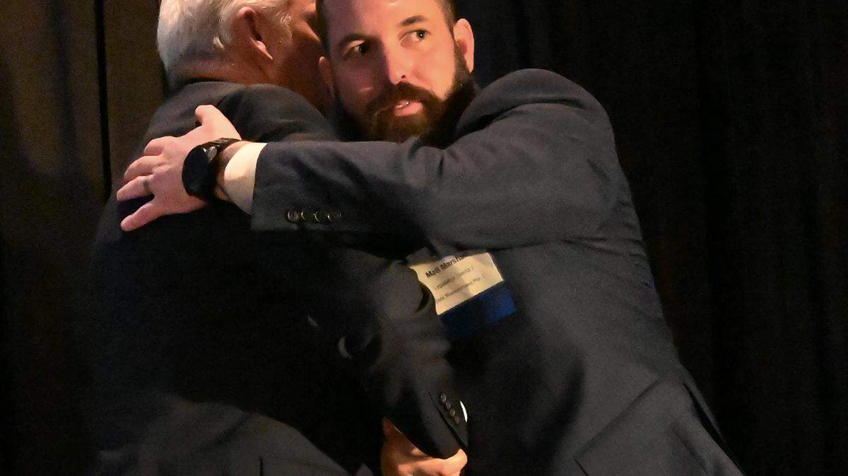 Legislative District 2 State Representative candidates Matt Marshall (right) and John Snaza embrace after the Thurston County Chamber Forum on Wednesday, Sept. 11, at Saint Martin’s Norman Worthington Center.
