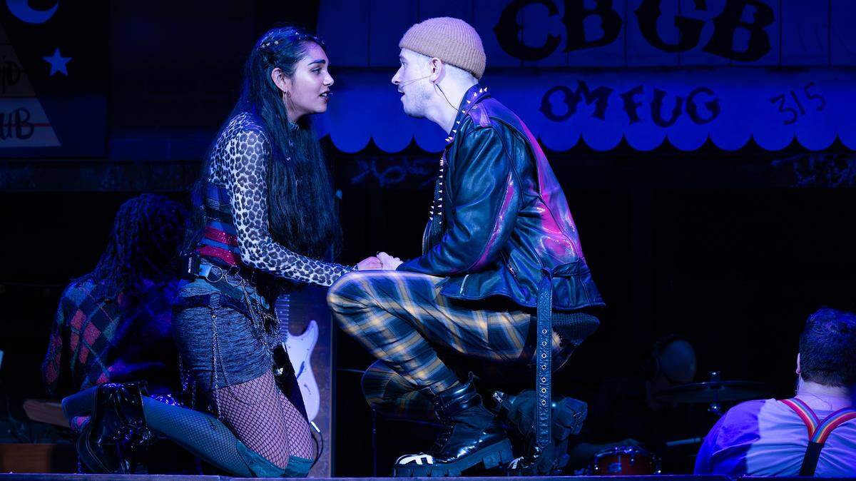 Mimi (Divya Parimi) and Roger (Denim Protégé) find love amid hardship in “Rent,” on stage through Sunday, July 27, at Harlequin Productions’ State Theater in downtown Olympia.