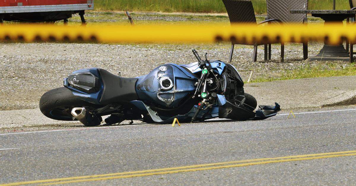 Olympia Police Dept. investigators process the scene of a morning fatal motorcycle crash in the 3700 block of Pacific Avenue Southeast Tuesday, May 31, 2022 Witnesses at the scene tried to resuscitate the man, but he died at the scene, according to OPD spokesperson Lt. Paul Lower.