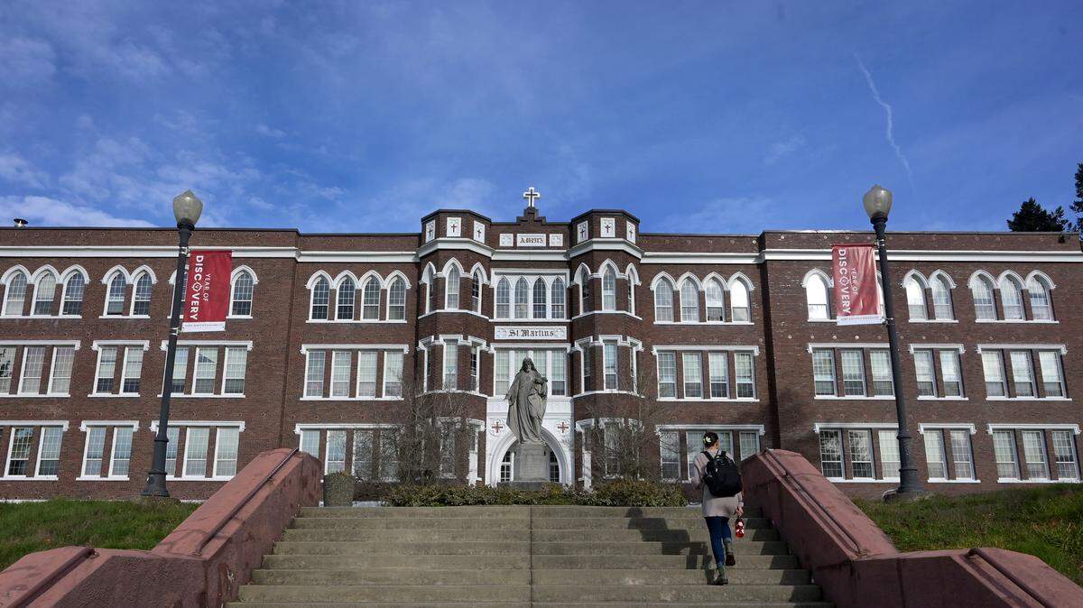Old Main on the Saint Martin’s University campus in Lacey. The Benedictine college has cut faculty salaries to help address a budget shortfall for this year.