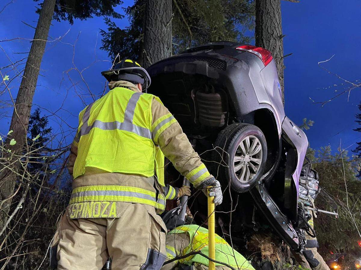 Lacey Fire District 3 crews helped remove the woman from her damaged car Friday night.