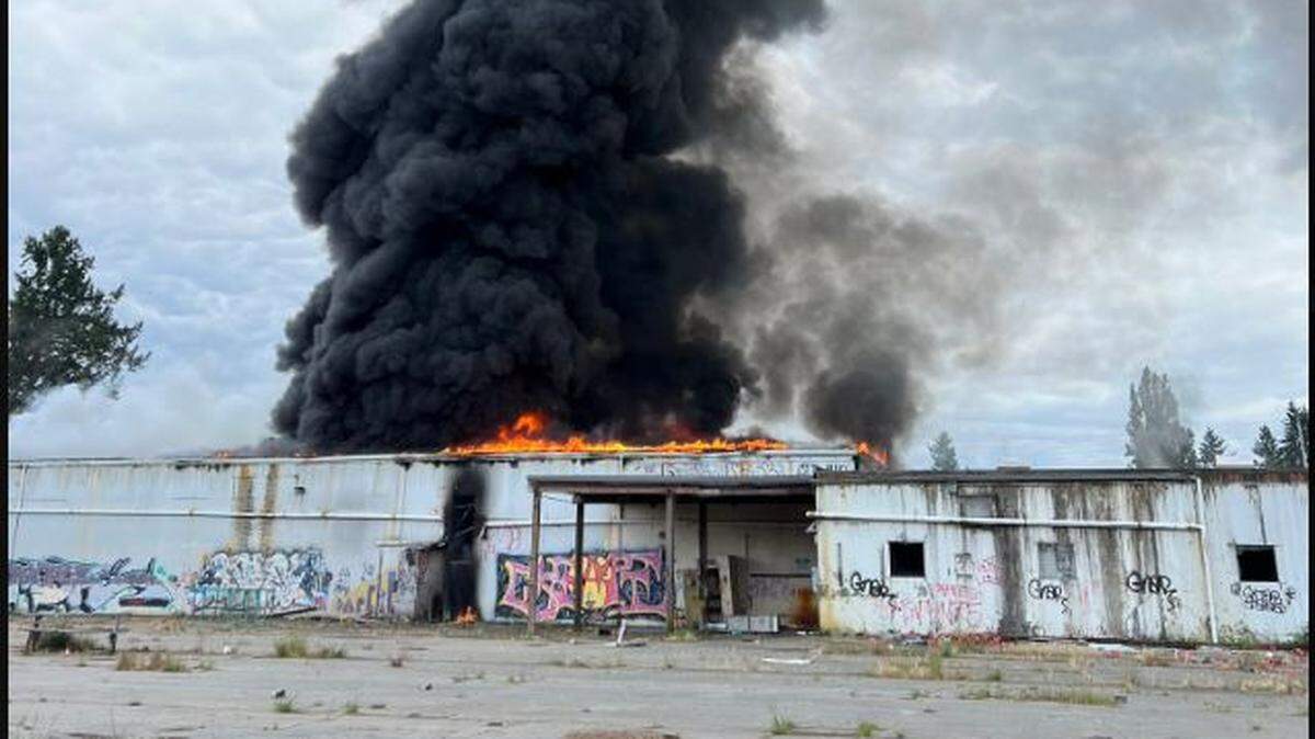 Seven fire districts, including Lacey Fire District 3, were dispatched Wednesday to a blaze that damaged a large vacant building at a former mushroom farm.