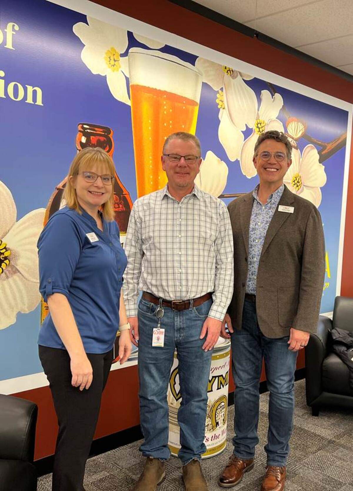 Martha Prestin, CFO, and Andrew Downin, CEO of O Bee Credit Union, with Thurston County Food Bank Executive Director, John Flicker.