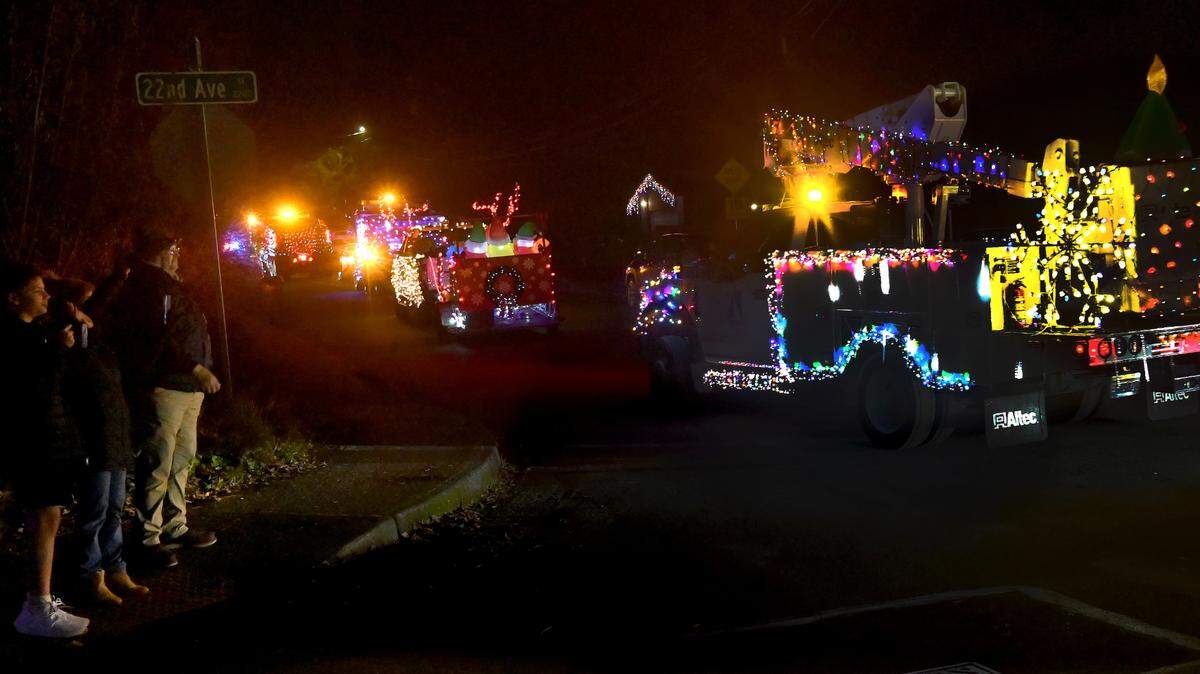A convoy of City of Olympia vehicles decorated with holiday lights makes it way up 22nd Avenue Southeast to start the Dec. 11 Holiday Light Parade. The 90-minute parade, which is winding its ways through various city neighborhoods this month, features about two dozen public works and fire vehicles. Margo Morales with the city’s Community Policing department is asking people watching along the routes to help keep the event safe by not approaching the moving vehicles or trying to cross the street through the parade route. The final light parade of the season will be Thursday, Dec 19, visiting the northeastern section of the city and South Capitol Neighborhood. More information along with a route map can be found on the City of Olympia website, https://www.olympiawa.gov/.