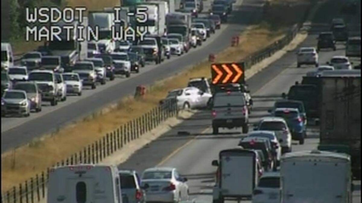 Traffic cameras show a collision that was partially blocking northbound Interstate 5 just after 9:15 a.m. on Friday, July 27, 2018.