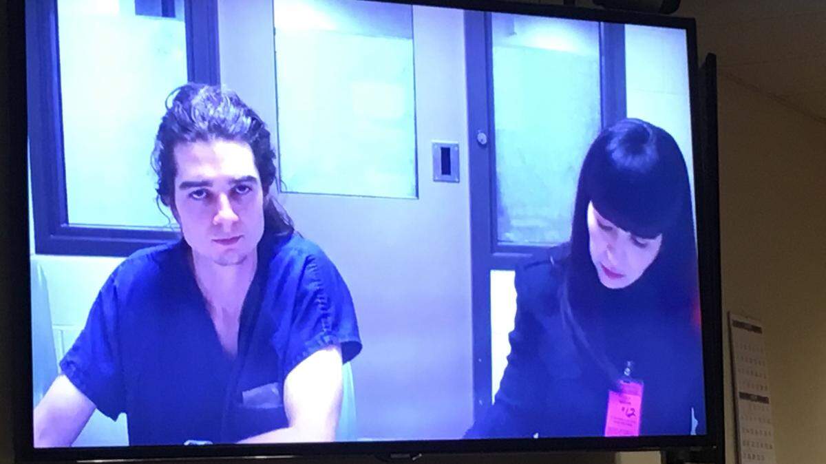 Nicholas J. Canino appeared in Thurston County Superior Court on Tuesday. Public defender Angela Colaiuta sits next to him.