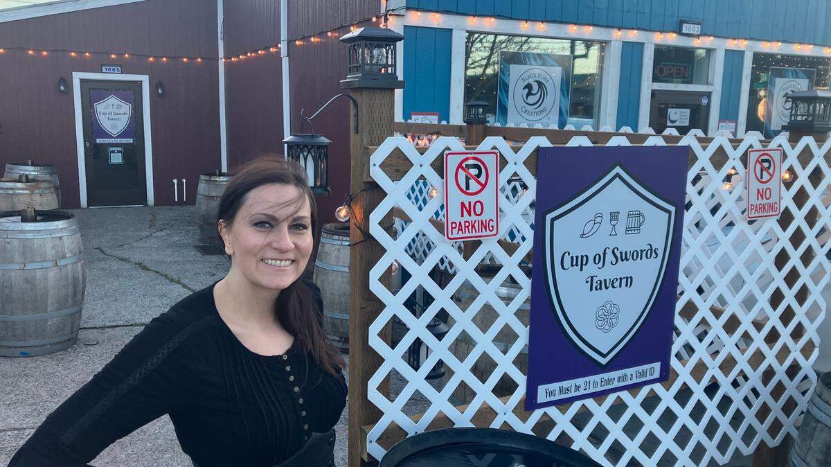 To the left, Cup of Swords Tavern, and to the right, Black Rune Creations. Both are owned by Lina Ciampi, Renaissance fair enthusiast.