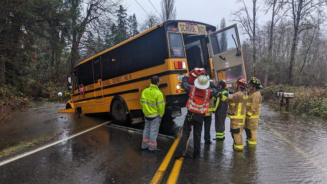 Firefighters rescue children from Olympia school bus stuck in flood waters Tuesday