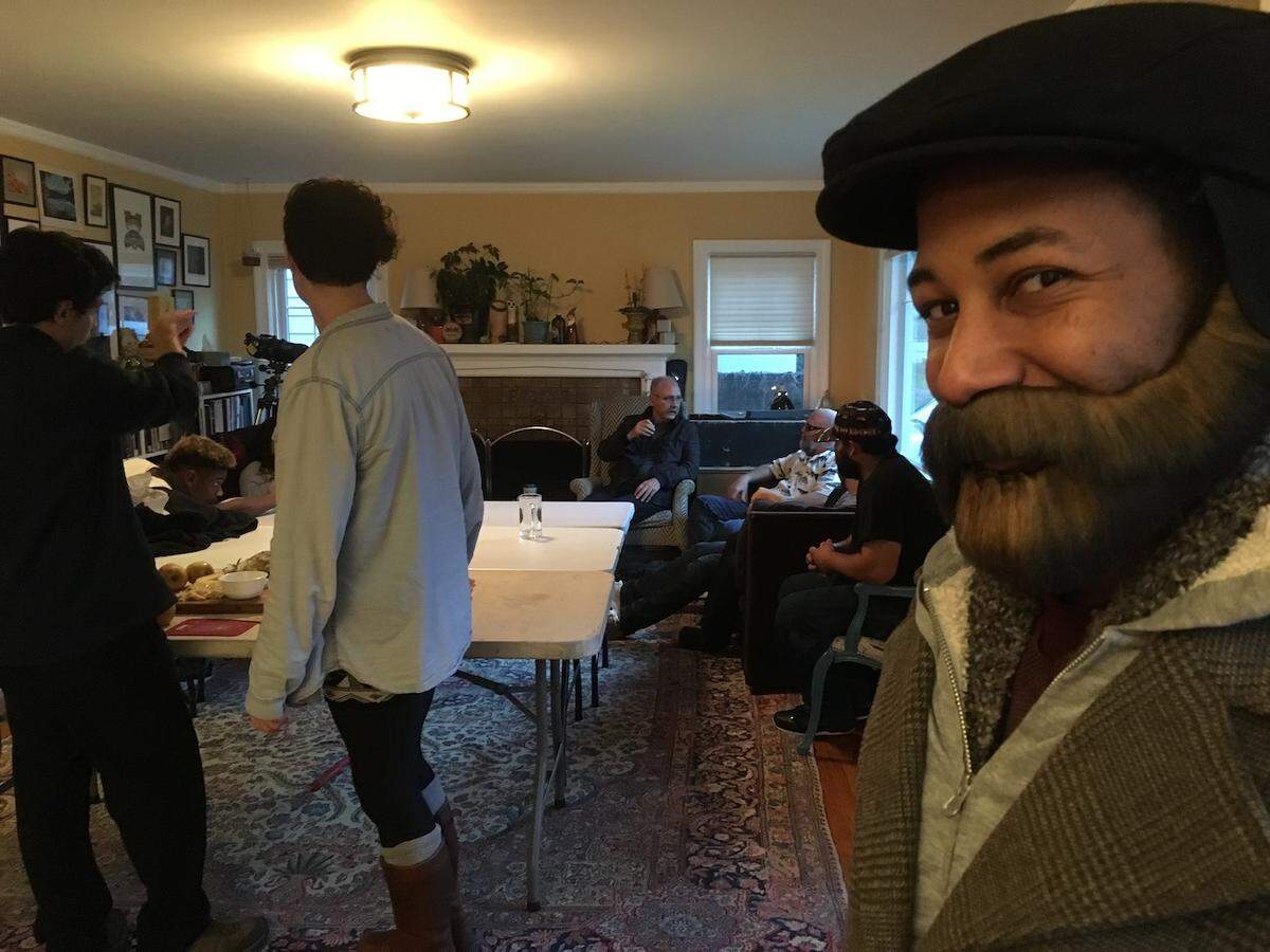 Jordan Richards, cleverly disguised with a fake beard, crashes a Friendsgiving party.