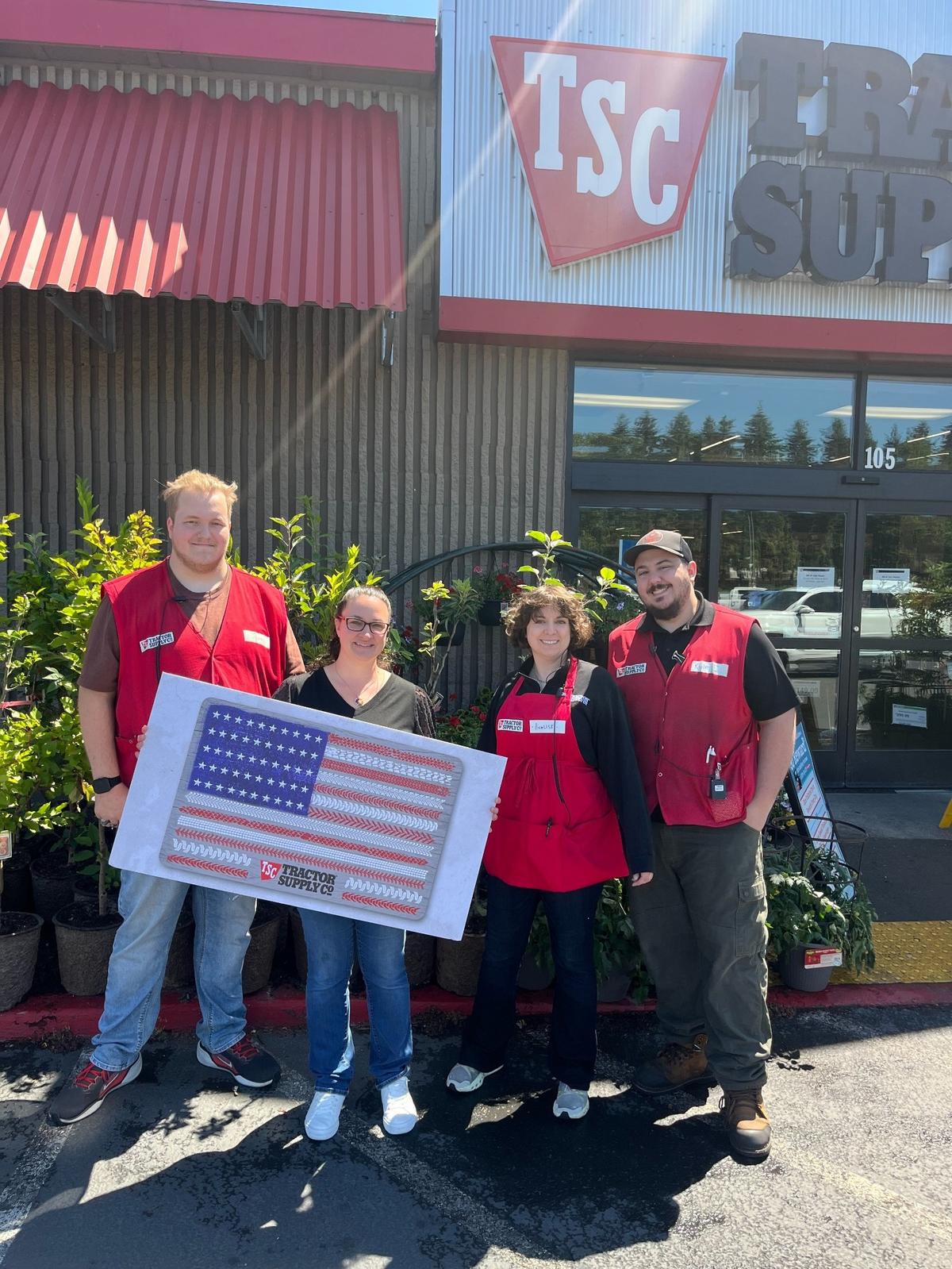 Olympia farmer Sarah Cordova is shown here with Tractor Supply Co. representatives.