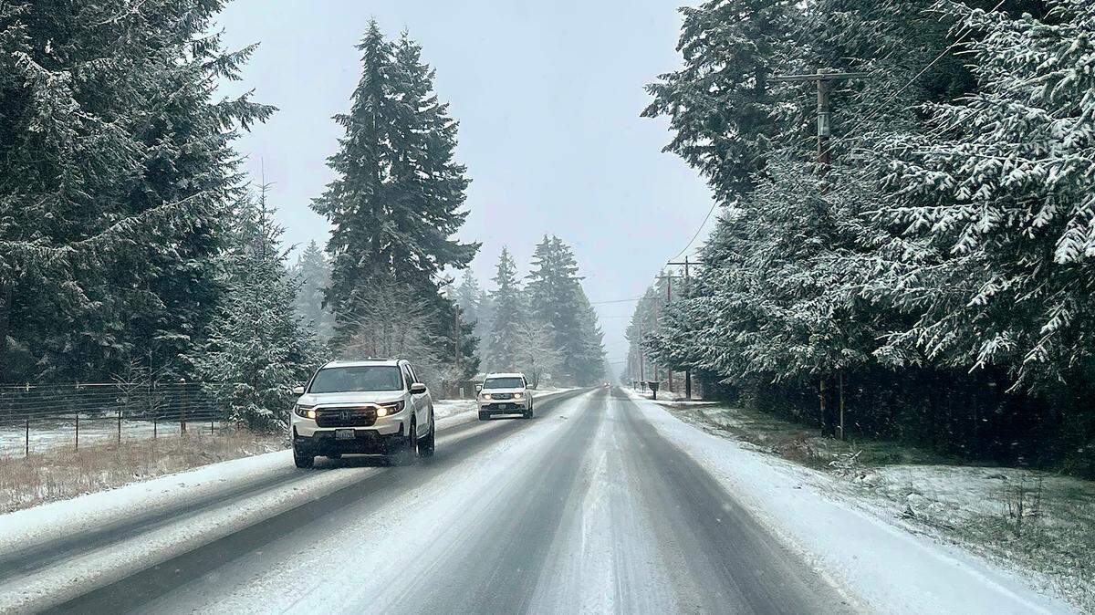 Thursday afternoon motorists traveling along 133rd Ave. SE near Rainier, Wa. were treated to a dose of winter wonderland as pockets of snowfall blanketed the south sound on Feb. 13, 2025. staff photo by Steve Bloom