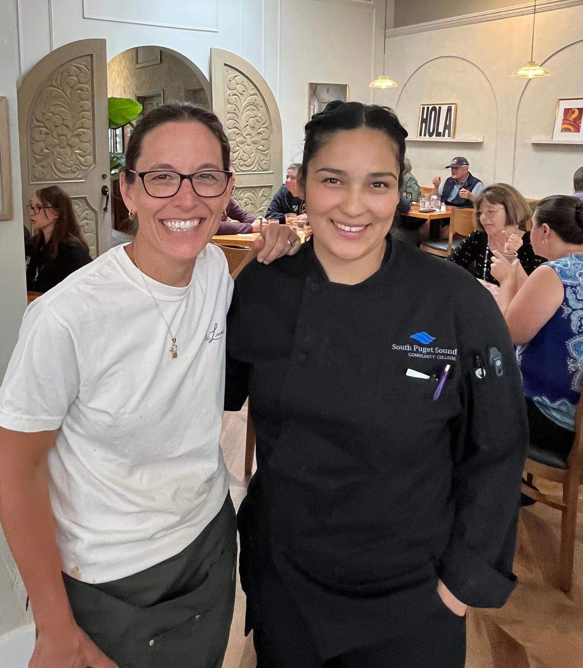 Mi Luna Cuban Cafe co-owner Kirsten Herrera-Root and her husband Rich Root work hand-in hand with their head chef Miriam Xiomara Padilla (r).