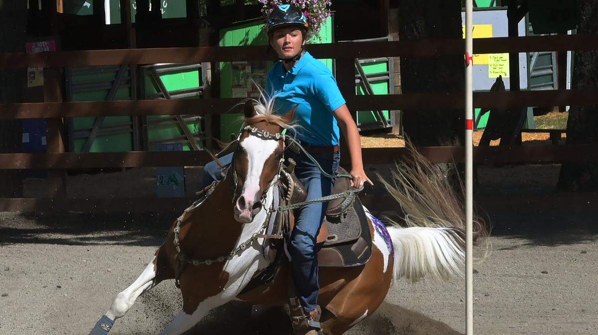 In her final year as a senior member of the Freedom Riders 4-H Club, Kailey Kolb flies to the finish of the Figure 8 competition with a blue ribbon time of 22.38 seconds at the 2022 Thurston County Fair.