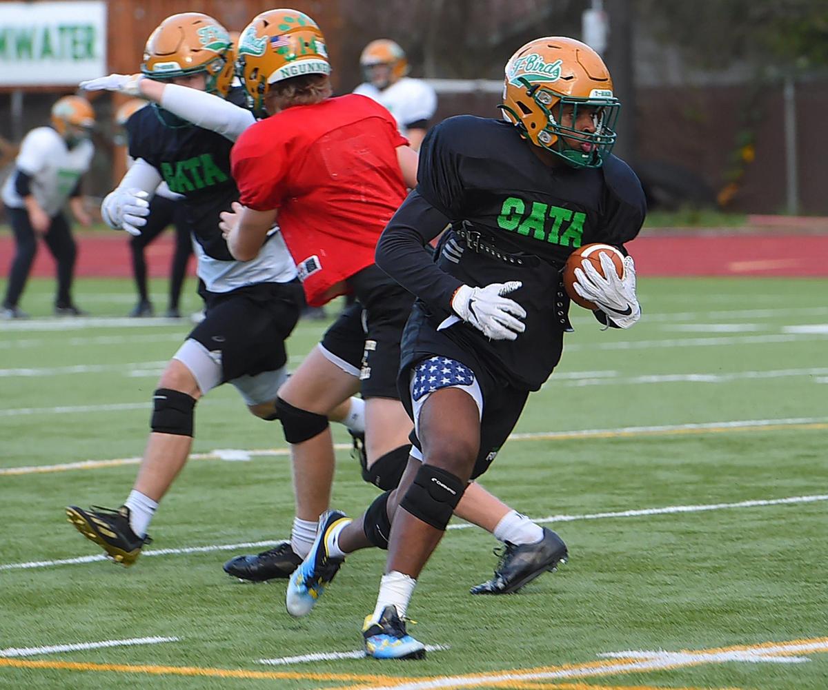 Tumwater RB Carlos Matheney heads upfield during the T-BirdsÕ Dec. 1 practice