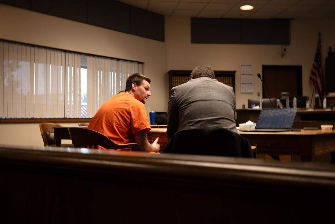 Christopher Edward Snyder, 32, (left) speaks to his defense attorney Albert Didcock (right) during his sentencing hearing in Thurston County Superior Court on Wednesday, Nov. 26, 2025. Judge Christopher Lanese ultimately sentenced him to over 55 years in prison in connection to the death of Zebediah Starbrow Schoening, 47.