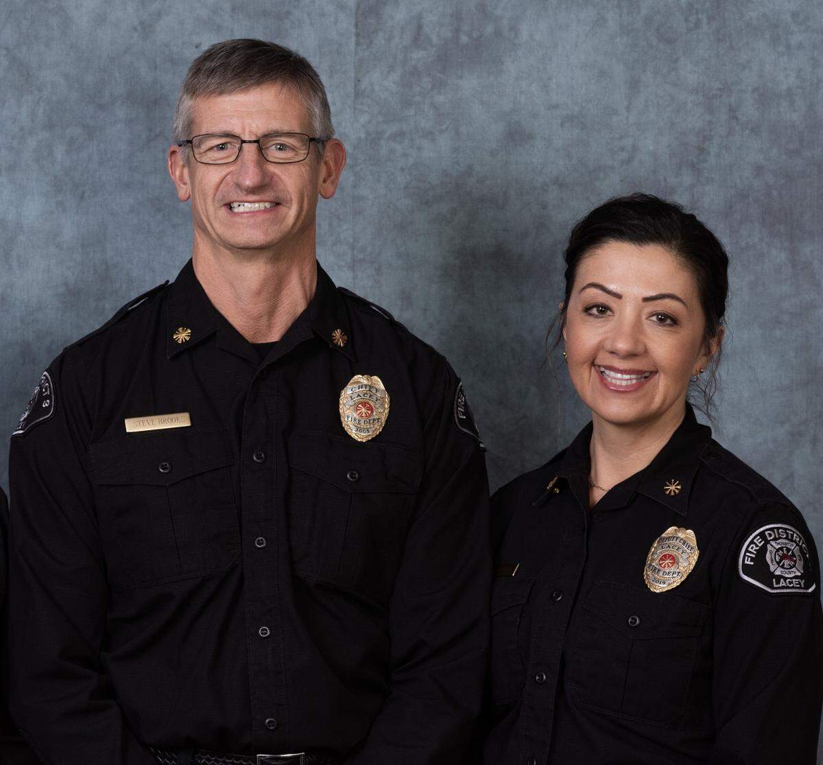 Lacey Fire District 3 Chief Steve Brooks and incoming fire Chief Jennifer Schmidt.
