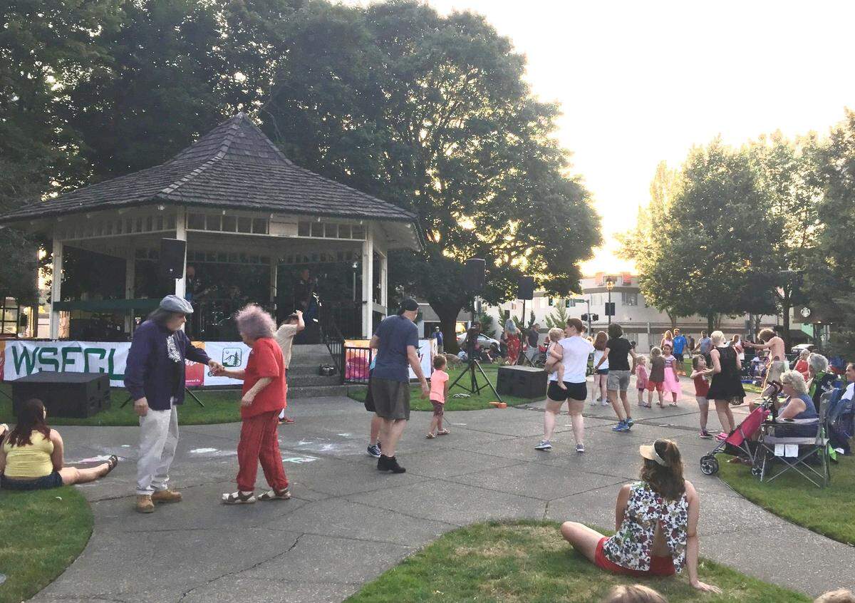 People dance and listen at a 2019 Music in the Park concert at Sylvester Park.