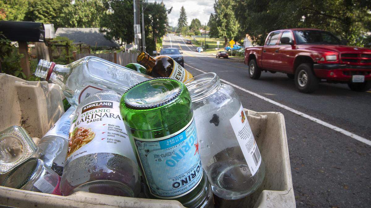 Separated glass recycling waits for pick up in Tumwater on Wednesday, Sept. 18, 2019.