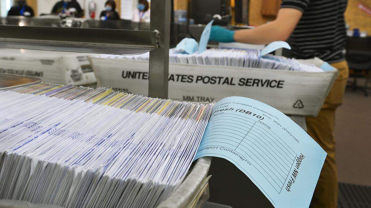 Ballots for the Aug. 3 primary election are tabulated at the Thurston County Ballot Processing Center in Tumwater.