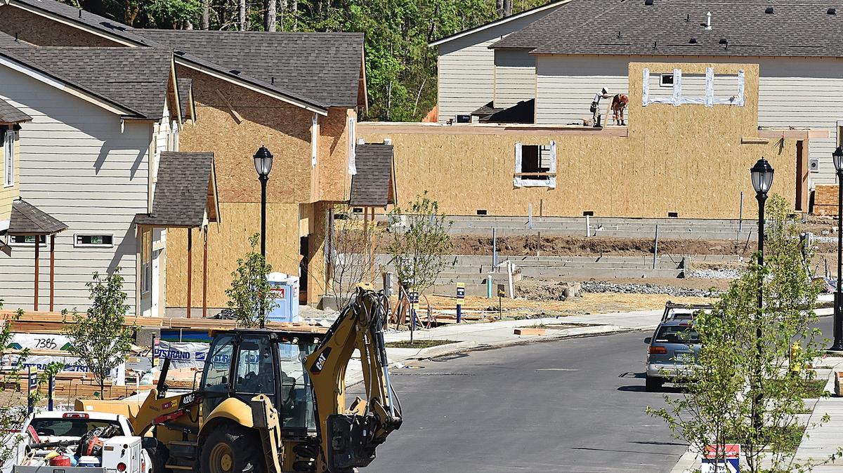 Crews work in a new housing development near Cabela's in Lacey Thursday as single-family residence sales strongly rebounded in June after a May pullback, according to Northwest Multiple Listing Service data released Thursday.