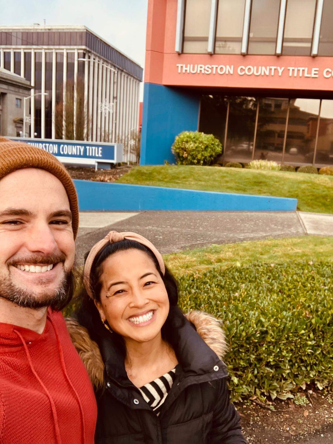 True Self Yoga owners Christina Lagdameo and Vajra Romano pose outside Thurston County Title after acquiring a nearby building to expand their west Olympia business.