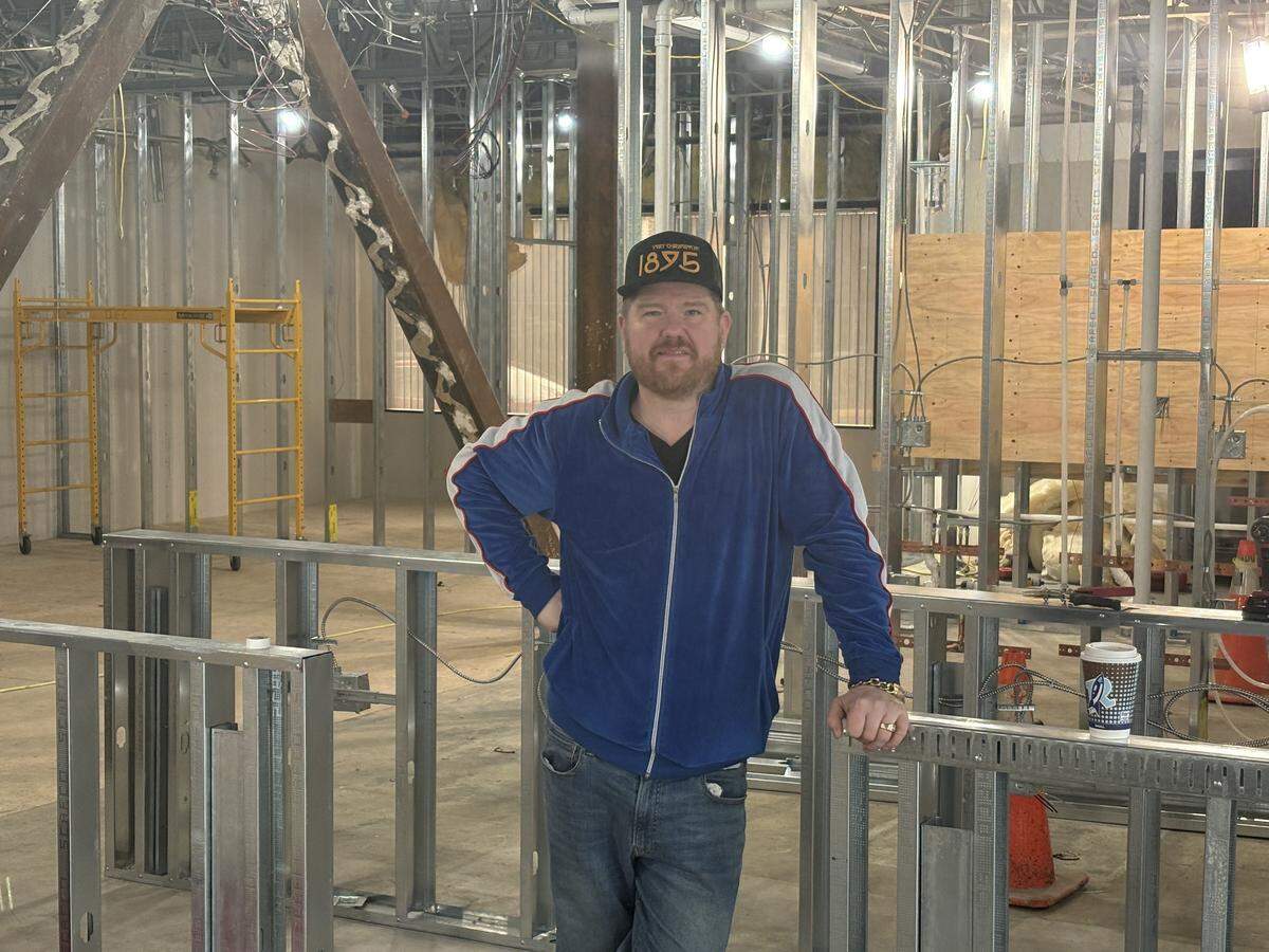 Bottega owner Rick Nelsen at his Lacey location as the walls take shape behind him.