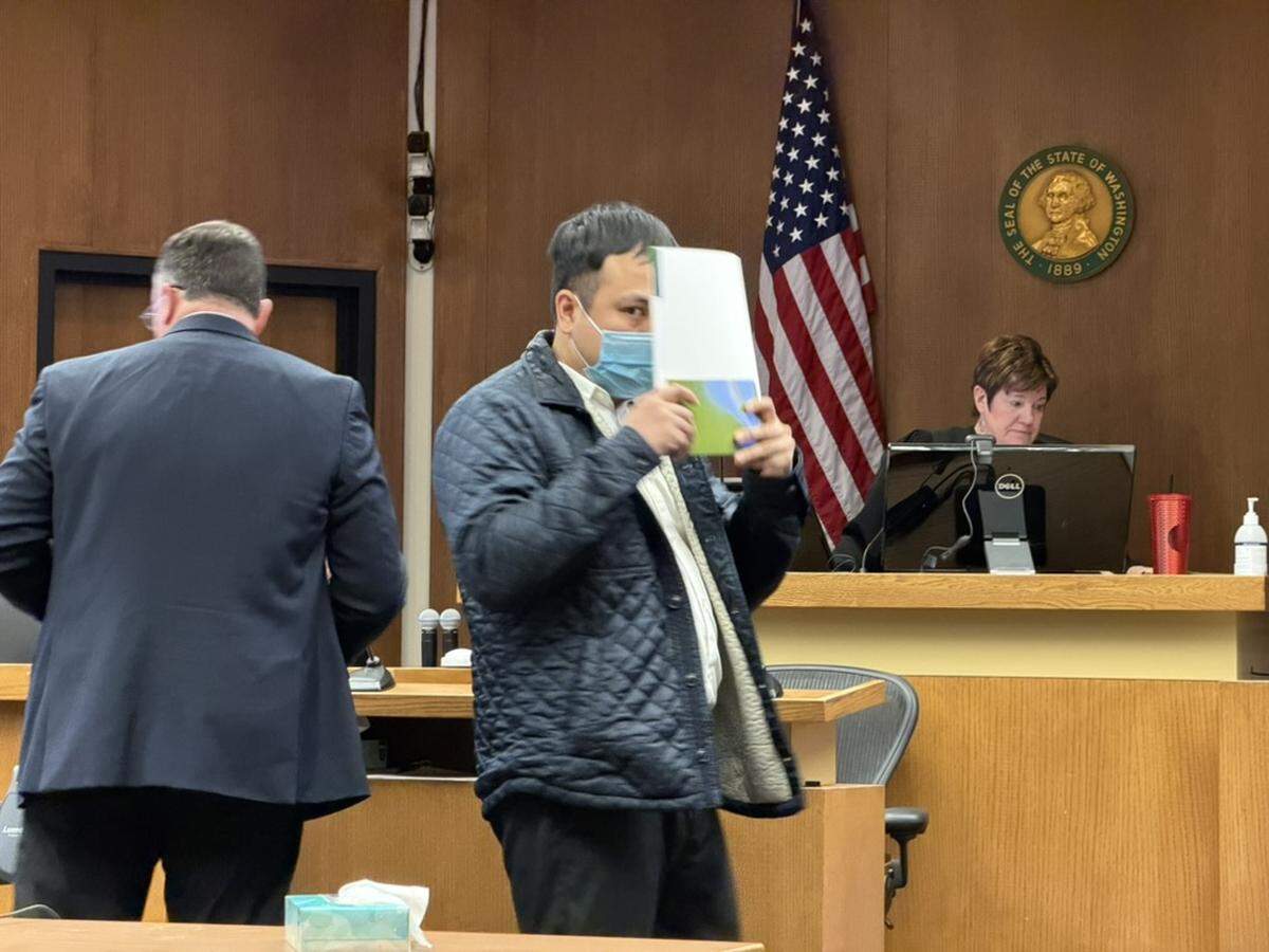Son Thien Nguyen, 34, hides his face after pleading guilty Tuesday, Feb. 10, 2026, to second-degree manslaughter and unlawful delivery of a controlled substance, ecstasy, in connection to the 2024 overdose death of Avery Ping, 16.