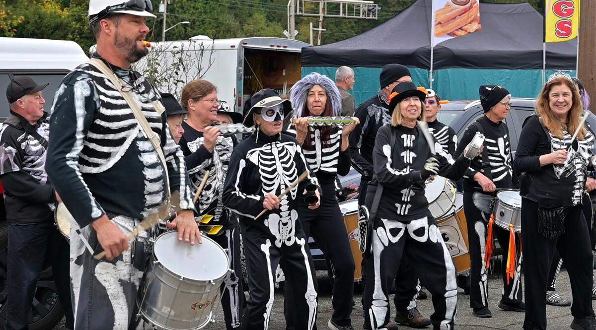 The Samba OlyWA percussionists entertain the crowd along the town of Bucoda’s Main Street before the pre-Halloween Hearse Procession. Boo-coda events happen all month in the small Thurston County town.