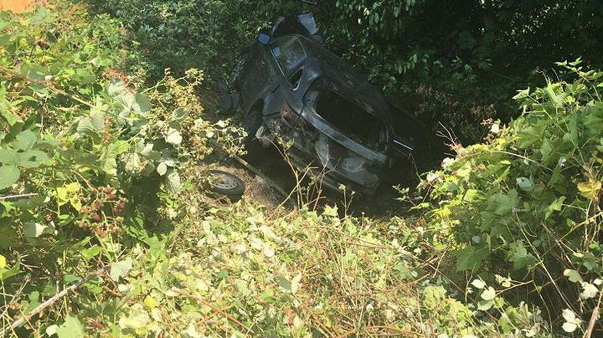 A 29-year-old woman rescued a senior citizen from a burning car Monday afternoon.