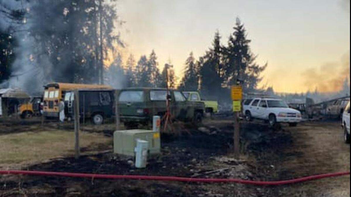 The fire, first dispatched about 5:20 p.m. Saturday, damaged a house, outbuilding and 20 vehicles in Rochester, according to West Thurston Fire.