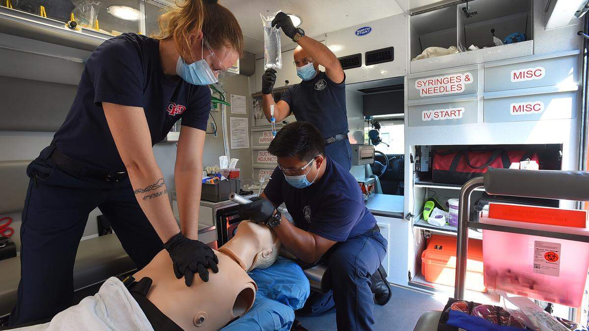 Using a practice dummy used in their earlier training session on July 27, 2021 at the Olympia Fire Department’s Station 4  Lt. Kehlen Doresy and fellow paramedic Julian Dizon along with firefighter Jon Jackson (in background) demonstrate how a coordinated emergency medical response might look like from inside of a Medic One ambulance.

Located off of Stoll Road Station 4 is one of the busiest stations in Thurston County for emergency calls.
