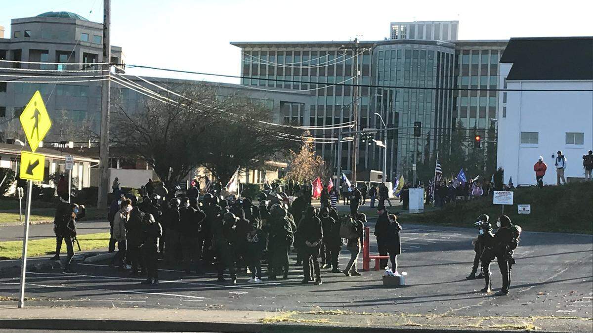 Counter-protesters gather in a lot Saturday afternoon near the Capitol Campus. A pro-Trump rally eventually clashed with the counter-protesters, leading to the arrest of a 27-year-old man, Olympia police reported.