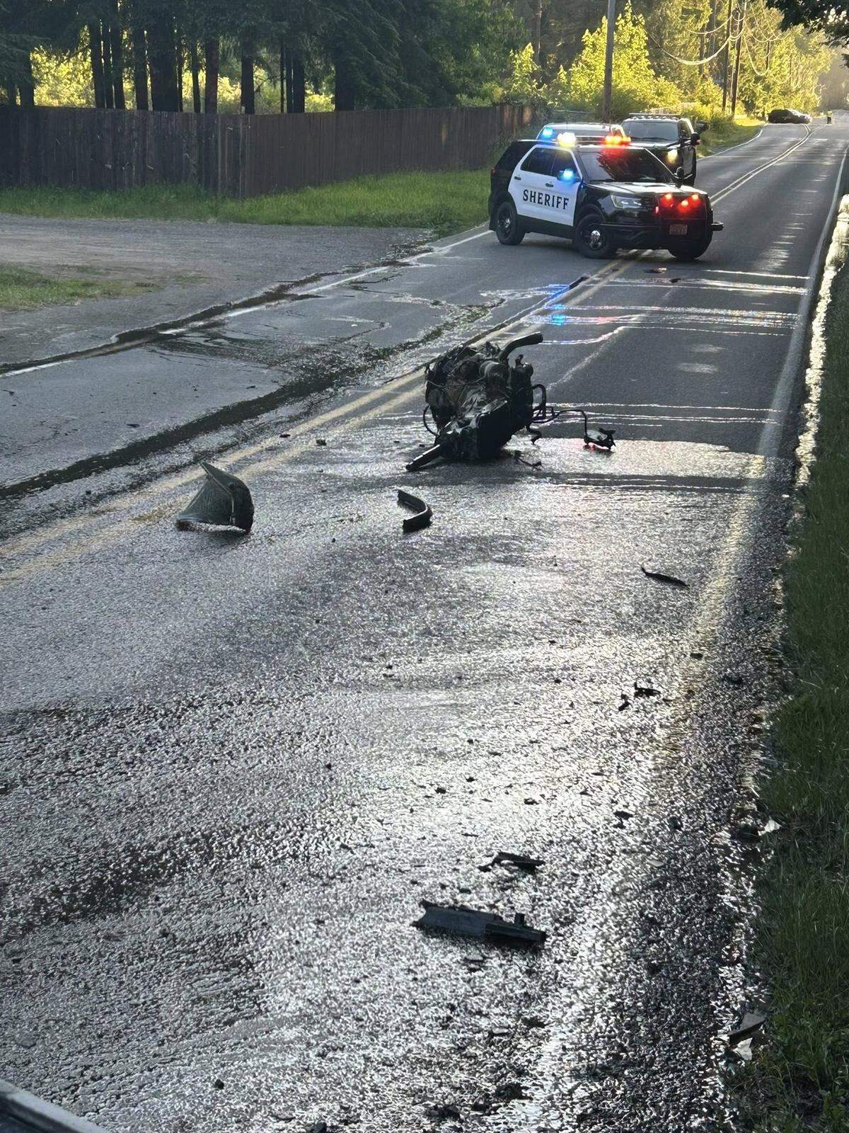 The engine sits on 93rd Avenue Southeast Friday evening after it became disconnected from a car as a result of a single-vehicle collision.