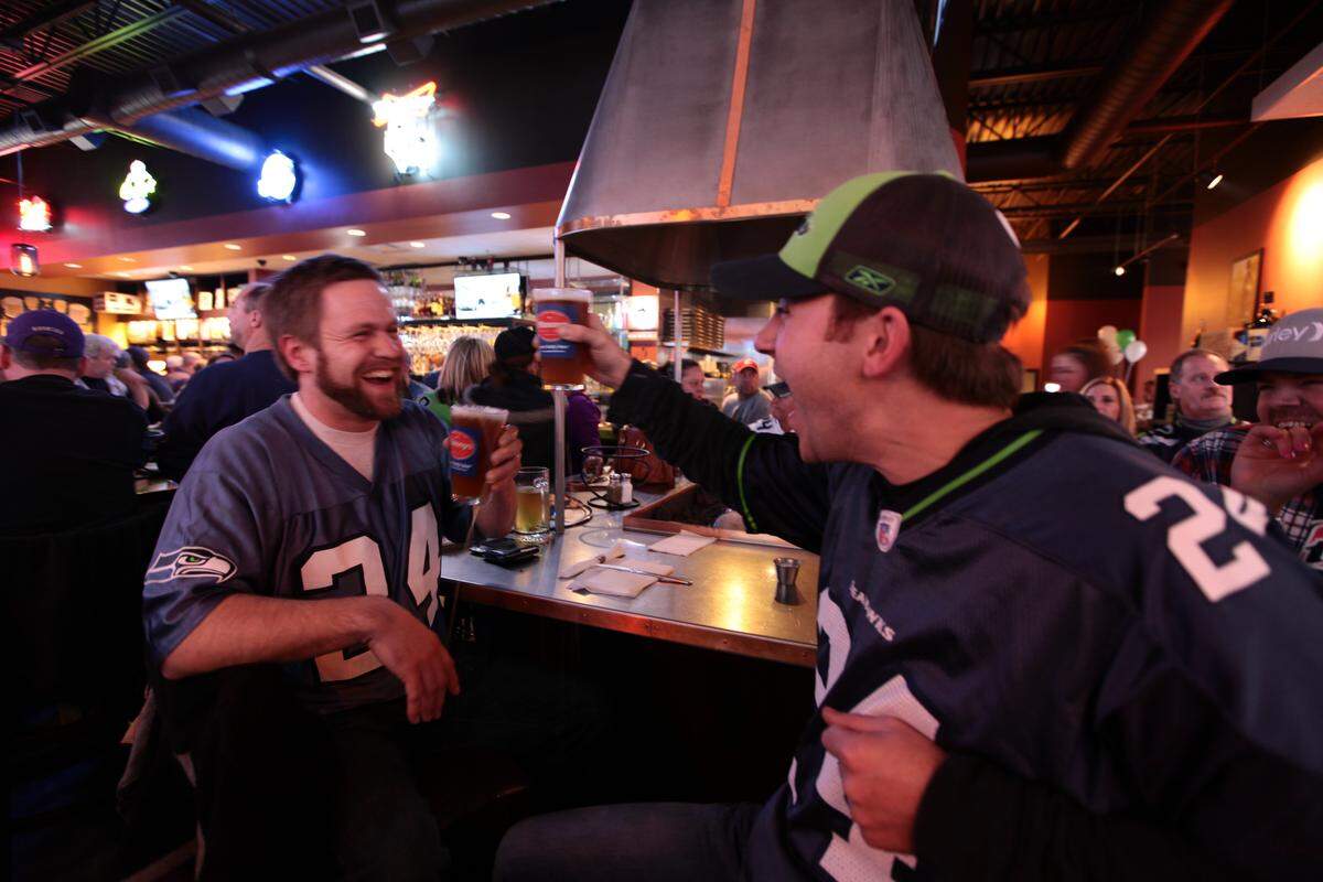 Two pumped up Seahawks fans at Farrelli’s Pizza.