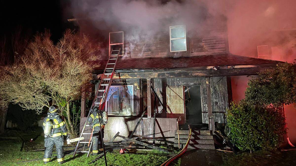 Smoke billows from a home on the corner of North First Street and West Pine Street in Shelton in the early hours of Wednesday, Feb. 15.