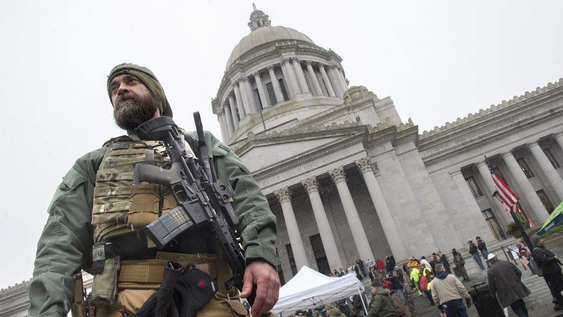 A man who identified himself only as Todd from Vancouver stands outside the Washington State Capitol during the Gun Rights Coalition rally on Friday, Jan. 17, 2020. “Constitutional rights that have been there forever are being trampled by (Governor Jay) Inslee and (Attorney General Bob) Ferguson, taking away our ability to defend ourselves,” he said. “We’re not going to put up with it. Period.”